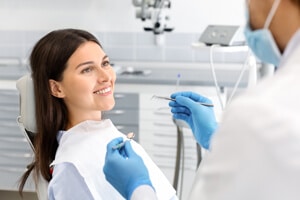 Orangeville dentist about to clean smiling woman's teeth